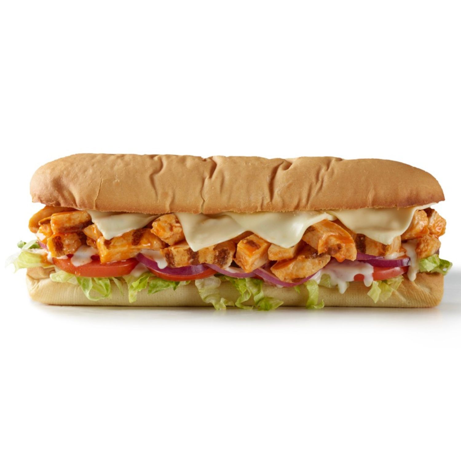 Side view of a buffalo chicken sub sandwich with buffalo-seasoned chicken, lettuce, tomato, red onion, cheese, and sauce on a hoagie roll.