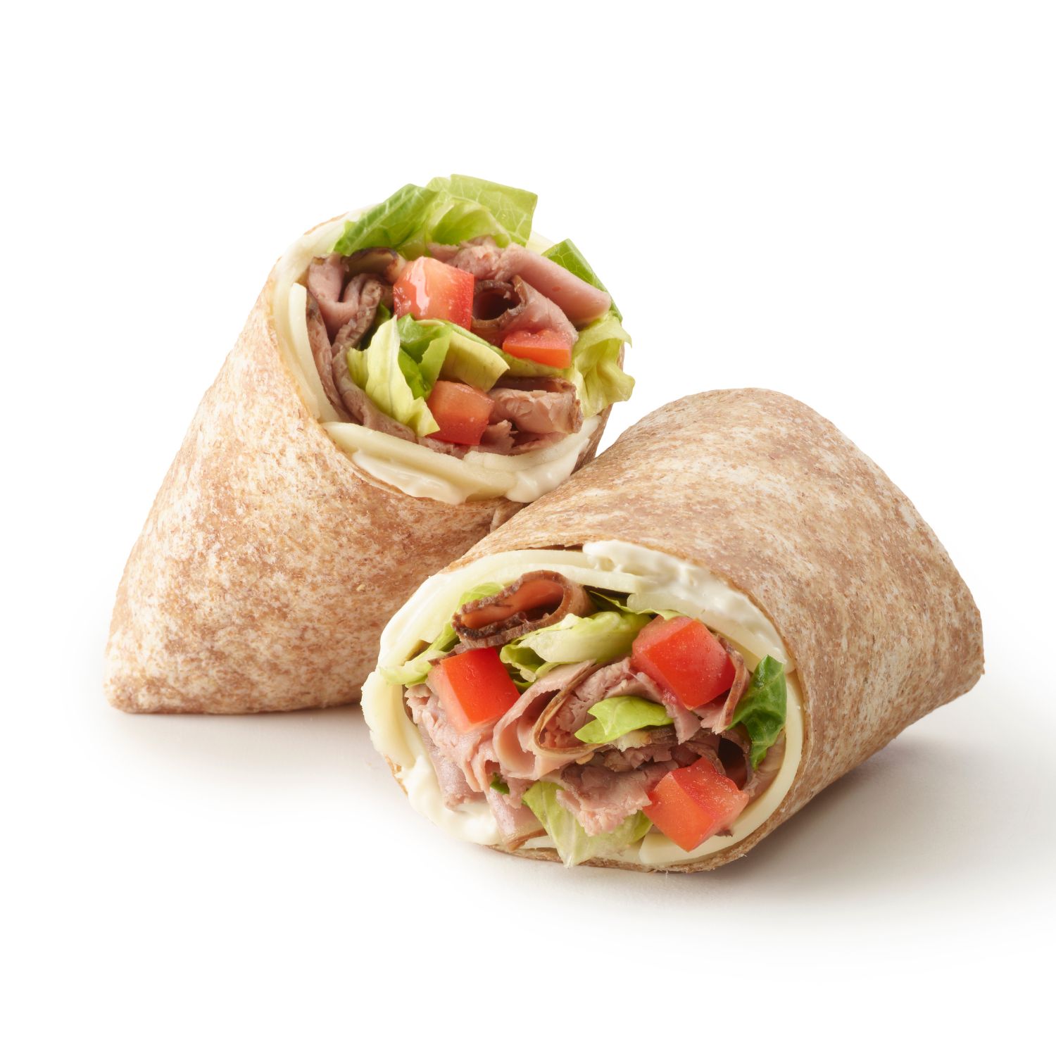 Close-up of a roast beef wrap with sliced beef, lettuce, tomato, and cheese in a whole wheat tortilla.